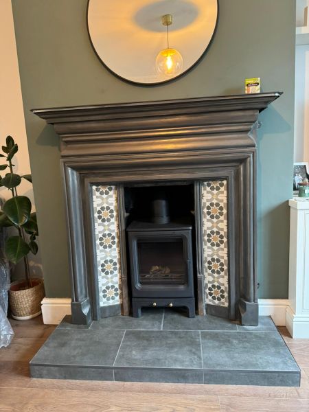Multi fuel log burner on a tiled hearth with original fire surround fitted in old dalby : Swipe To View More Images