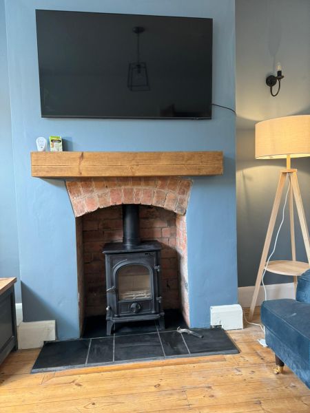 Knock out and restored natural brick fitted customers log burner that they sourced and we tiled with a black slate hearth : Swipe To View More Images